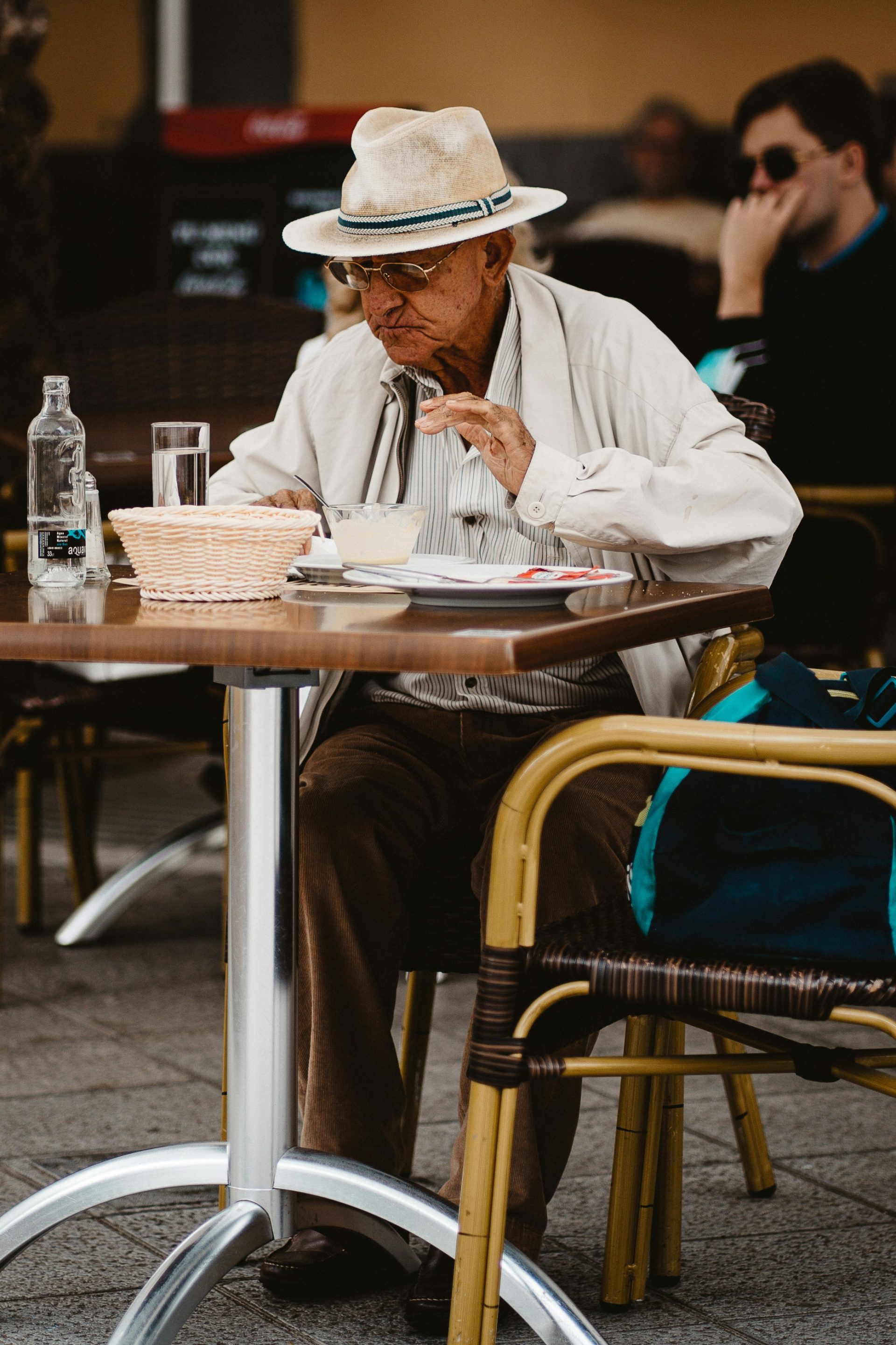 man in white dress shirt sitting on chair